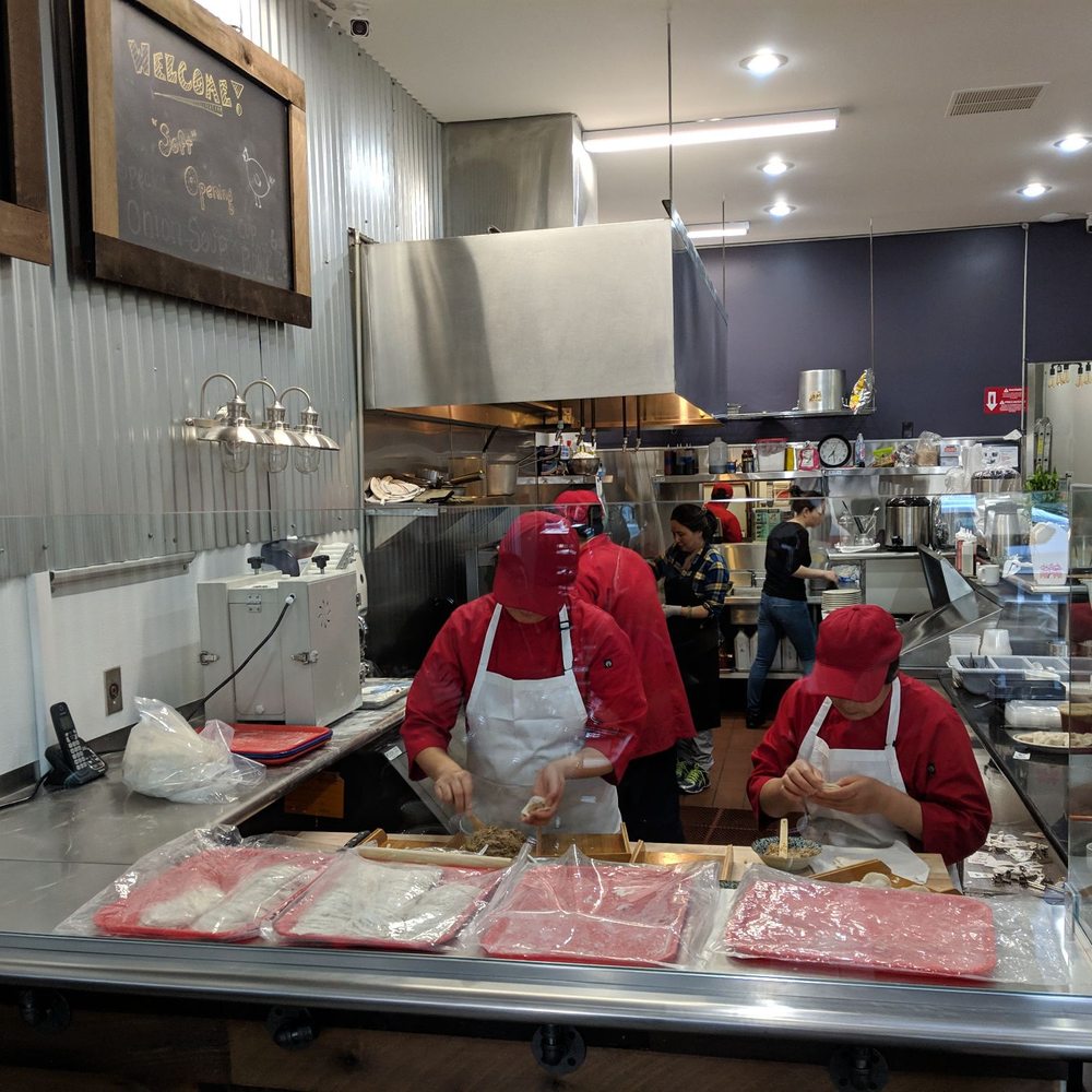 New Dumpling - Interior - folding dumplings. - Chinese Near Me - El Cerrito, California New Dumpling - Interior - folding dumplings. - Chinese Near Me - El Cerrito, California