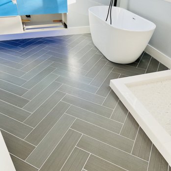 Haiyuan Construction - a bathroom with a large bathtub - General Contractors Near Me