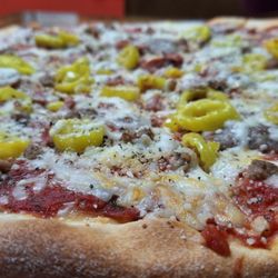Nino's Pizza - Meat lovers 14" with added banana peppers.