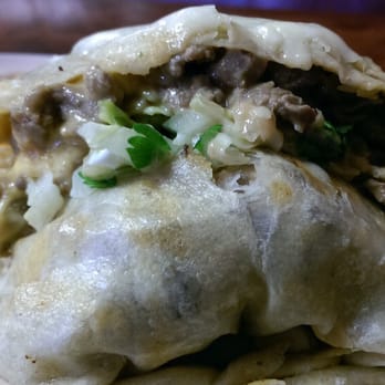 El Palmar - A peek into the burrito. - Mexican Near Me - Waukesha, Wisconsin El Palmar - A peek into the burrito. - Mexican Near Me - Waukesha, Wisconsin