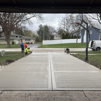 Fortis Paving - Concrete finishers completing a California finish on a new driveway - Masonry/Concrete Near Me - Roselle, Illinois Fortis Paving - Concrete finishers completing a California finish on a new driveway - Masonry/Concrete Near Me - Roselle, Illinois