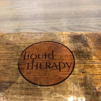 Liquid Therapy - a close up of a wooden table - Breweries Near Me - Nashua, New Hampshire