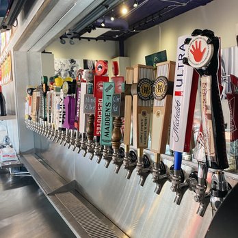 Barley and Vine - a row of beer taps - Wine Bars Near Me - Bentonville, Arkansas Barley and Vine - a row of beer taps - Wine Bars Near Me - Bentonville, Arkansas