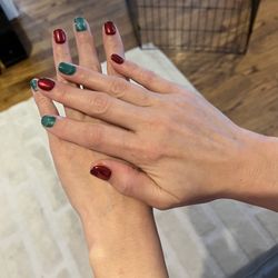 Aphrodite SPA & NAILS - Holiday nails with green " cat-eye"
