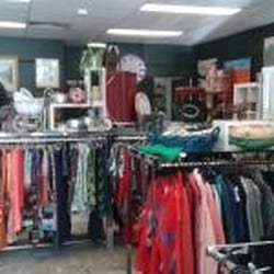 Sacred Heart Mission Op Shop - Clothes are neatly hung.