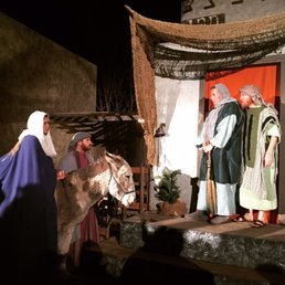 Mary and Joseph ask for a room at the Innkeepers
