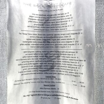 Back Porch Cafe - Menu posted facing sidewalk. March 2025 so before opening for the 2025 season. - New American Near Me - Rehoboth Beach, Delaware Back Porch Cafe - Menu posted facing sidewalk. March 2025 so before opening for the 2025 season. - New American Near Me - Rehoboth Beach, Delaware