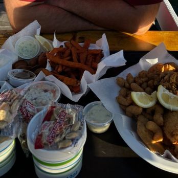 Boothbay Lobster Wharf - Seafood sampler (fried shrimp, scallops, mussels, haddock), bacon wrapped oysters (fried), clam chowder, coleslaw, sweet potato fries, - Seafood Near Me - Boothbay Harbor, Maine