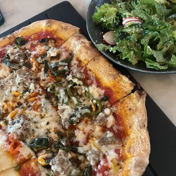 Serious Pie Downtown - Sweet Fennel Sausage Pizza and Mixed Greens Salad - Pizza Near Me - Seattle, Washington Serious Pie Downtown - Sweet Fennel Sausage Pizza and Mixed Greens Salad - Pizza Near Me - Seattle, Washington