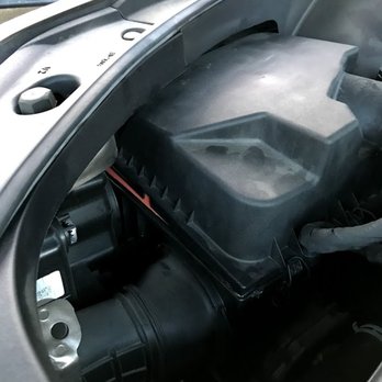 Sun Auto Service - filter sticking out the side, cover not closed, because the filter is too big - Auto Repair Near Me - Henderson, Nevada