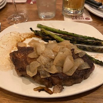 Outback Steakhouse - 12oz rib eye with grilled onions and asparagus. - Steakhouses Near Me - Oviedo, Florida