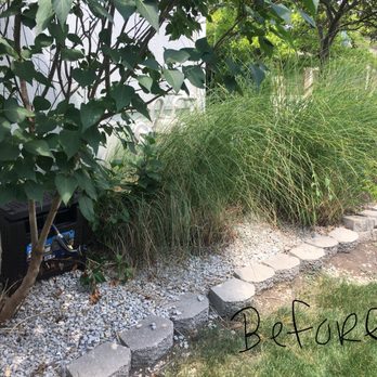 Tuff Turf Landscape - Before, with old retaining wall, gravel and over grown fescue grasses. - Landscaping Near Me - Merriam, Kansas Tuff Turf Landscape - Before, with old retaining wall, gravel and over grown fescue grasses. - Landscaping Near Me - Merriam, Kansas