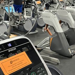24 Hour Fitness - A sea of orange "out of service" signs on cardio equipment