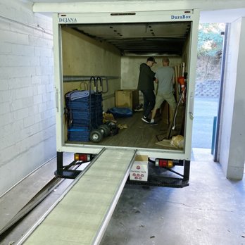 Your Moving Men - Slava (left) and Yurii (right) cleaning up the truck after the move in. - Movers Near Me - Rockville, Maryland