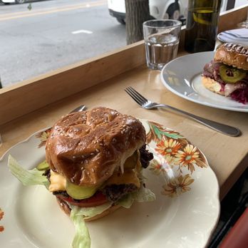 Provisions - a plate with a sandwich and a glass of water - Meat Shops Near Me - Outremont, Quebec Provisions - a plate with a sandwich and a glass of water - Meat Shops Near Me - Outremont, Quebec
