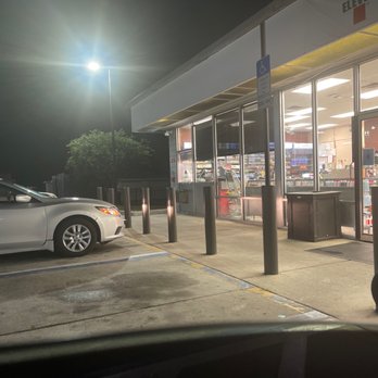 7-Eleven - a car parked in front of a convenience store - Convenience Stores Near Me - Hudson, Florida