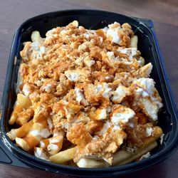 Kiki's Chicken Place - Regular sized Kiki fries plus garlic and an extra chicken tender.