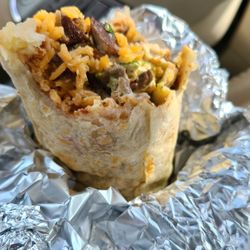 Pollos Asados Don Rafa - Carne asada super burrito  with rice,  beans, pico de gallo salsa, cheese, sour cream, green salsa and guacamole !