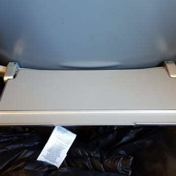 Frontier Airlines - HUGE tray for ........ my smartphone. So glad they thought of that. - Airlines Near Me - Denver, Colorado