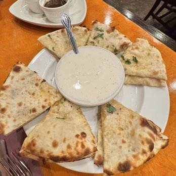 Saffron - Garlic Cheese Naan Onion Kulcha - Indian Near Me - Saint Louis, Missouri Saffron - Garlic Cheese Naan Onion Kulcha - Indian Near Me - Saint Louis, Missouri