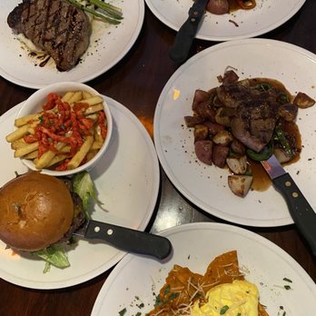 Wildfire Public House - New York steak-roasted garlic, flaming ribeye, chilaquiles, and Wildfire burger with cheddar and a side of fire fries. - Breakfast & Brunch Near Me - Modesto, California Wildfire Public House - New York steak-roasted garlic, flaming ribeye, chilaquiles, and Wildfire burger with cheddar and a side of fire fries. - Breakfast & Brunch Near Me - Modesto, California