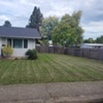 Deep Dive Lawn - a house in the background - Lawn Services Near Me Deep Dive Lawn - a house in the background - Lawn Services Near Me