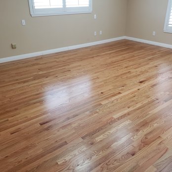 Evans Flooring - Master Bedroom. Baseboards primed and installed but before caulk and paint. - Flooring Near Me