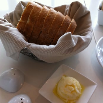 the C restaurant + bar - Fresh warm herb bread with goat cheese butter and drizzled olive oil! - Seafood Near Me - Monterey, California the C restaurant + bar - Fresh warm herb bread with goat cheese butter and drizzled olive oil! - Seafood Near Me - Monterey, California
