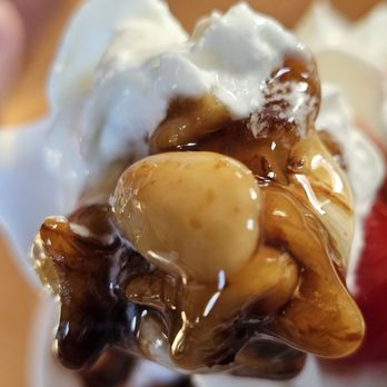 Richee Freeze - A spoonful of the ice cream sundae with soft vanilla ice cream and chocolate syrup. - Burgers Near Me - Roanoke, Virginia