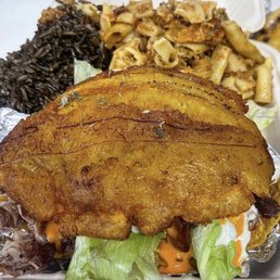 Plantain sandwich with fried pork, rice and Mac and cheese. Plantain sandwich with fried pork, rice and Mac and cheese.