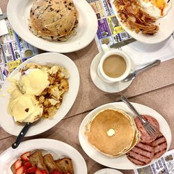 The Fontainbleau Diner - Chunky Monkey Pancakes, two eggs and bacon, Golden Brown Pancakes with Meat, and Eggs Benedict