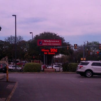 Walgreens - a car parked in front of a store - Drugstores Near Me - San Antonio, Texas
