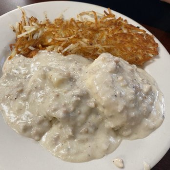 The Busted Yolk - a plate of food with gravy and hash browns - Breakfast & Brunch Near Me - Cato, New York