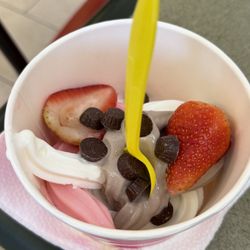 Tutti Frutti Frozen Yogurt - Mine with strawberry, cheesecake and chocolate flavor frozen yogurt topped with strawberries and candies.
