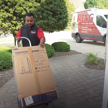 King Heating, Cooling & Plumbing - A King Heating, Cooling & Plumbing technician delivers a new tankless water heater, ensuring expert installation and reliable service. - Heating & Air Conditioning/HVAC Near Me - Oak Forest, Illinois King Heating, Cooling & Plumbing - A King Heating, Cooling & Plumbing technician delivers a new tankless water heater, ensuring expert installation and reliable service. - Heating & Air Conditioning/HVAC Near Me - Oak Forest, Illinois
