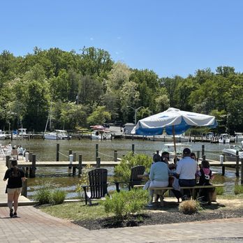 Donnelly's Dockside - a group of people sitting at a picnic table - Seafood Near Me - Arnold, Maryland Donnelly's Dockside - a group of people sitting at a picnic table - Seafood Near Me - Arnold, Maryland