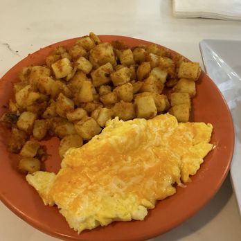 The Poked Yolk - Scrambled eggs with cheddar cheese and hashbrowns - Diners Near Me - Buffalo, New York The Poked Yolk - Scrambled eggs with cheddar cheese and hashbrowns - Diners Near Me - Buffalo, New York