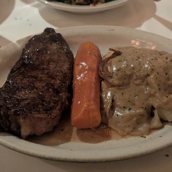 Bob's Steak & Chop House - NY strip, fried potatoes with gravy and a carrot - Steakhouses Near Me - Plano, Texas Bob's Steak & Chop House - NY strip, fried potatoes with gravy and a carrot - Steakhouses Near Me - Plano, Texas