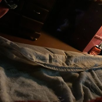 Cooter's - a person laying on a bed - Dive Bars Near Me - Eagle Pass, Texas