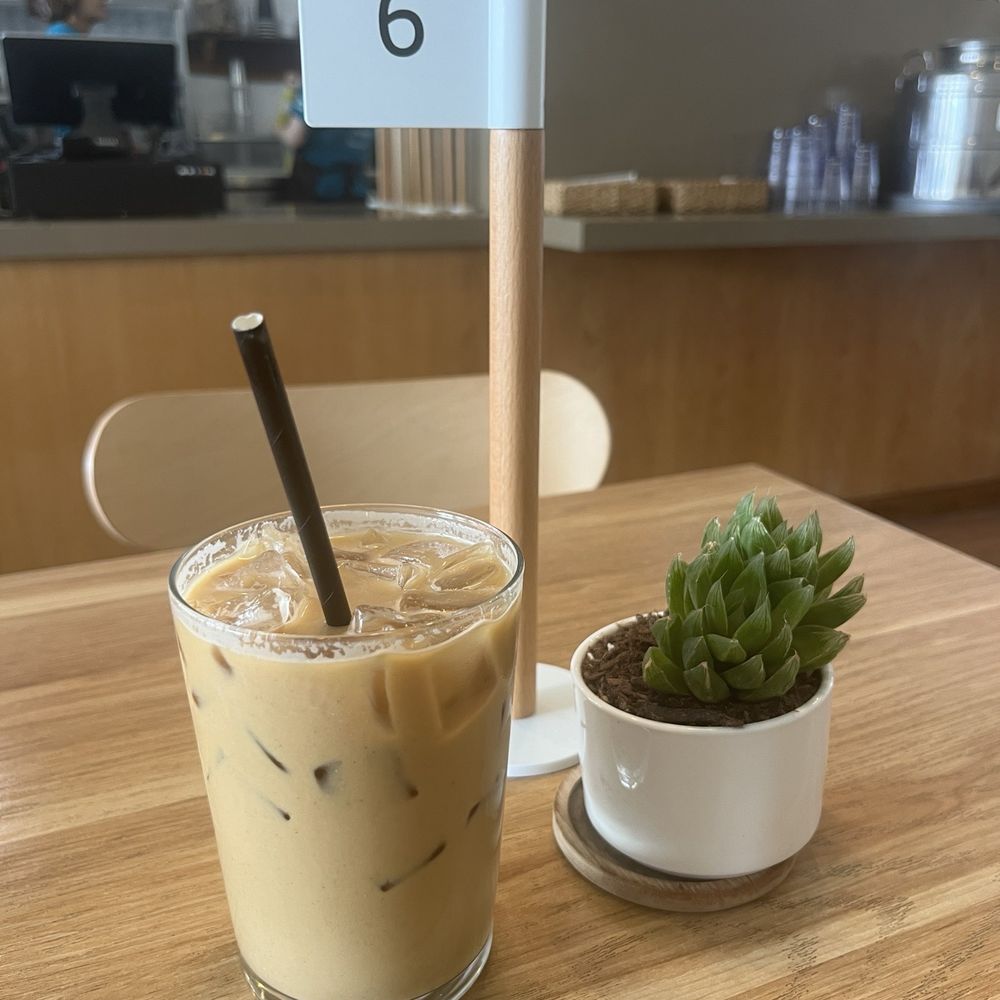 The Source Cafe - Latte with oat milk - $7.50 - Juice Bars & Smoothies Near Me - Hermosa Beach, California The Source Cafe - Latte with oat milk - $7.50 - Juice Bars & Smoothies Near Me - Hermosa Beach, California