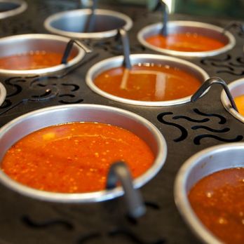 HuHot Mongolian Grill - a tray of chili sauces - Mongolian Near Me - Cedar Falls, Iowa