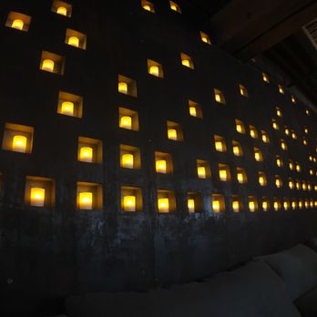 AIRE Ancient Baths - Chicago - Candlelit wall - Day Spas Near Me - Chicago, Illinois