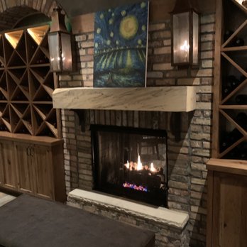 Moondance Grill - Waiting area by the bar has a fireplace - New American Near Me - Germantown, Tennessee