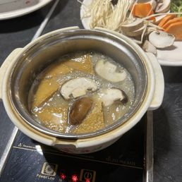 Tofu and mushrooms in the miso broth. Delicious! Tofu and mushrooms in the miso broth. Delicious!