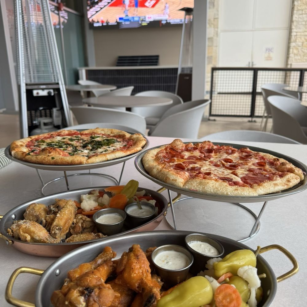 Margherita pizza, pepperoni pizza, and chicken wings Margherita pizza, pepperoni pizza, and chicken wings
