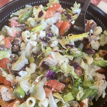 Portillo's Brandon - Portillo's chopped salad with lettuce, bacon pasta, feta cheese, scallion and tomato. - Burgers Near Me - Brandon, Florida