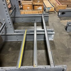 Booms Welding Fabrication - The bars before they were cut down.  The one with the yellow tape measurer is the size I need.