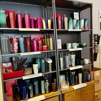 Starbucks - a display of starbucks mugs in a store - Coffee & Tea Near Me - Millbrae, California