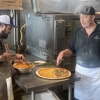 Brooklyn Boyz Pizza - This is the owner Denis making a half-and-half pie with big Baked Ziti - Pizza Near Me - Oceanside, California Brooklyn Boyz Pizza - This is the owner Denis making a half-and-half pie with big Baked Ziti - Pizza Near Me - Oceanside, California