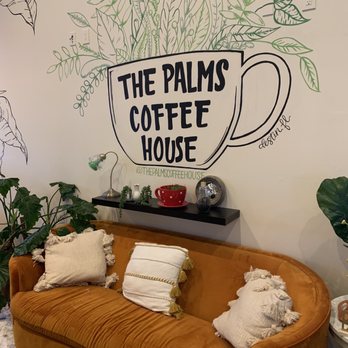 The Palms Coffeehouse - a couch in front of a mural - Coffee & Tea Near Me - Destin, Florida The Palms Coffeehouse - a couch in front of a mural - Coffee & Tea Near Me - Destin, Florida